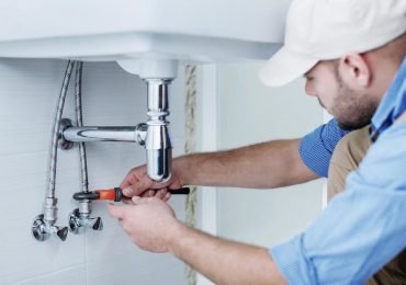 plumber repairing the bathroom sink plumbing in an arizona home